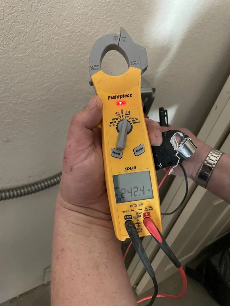 Voltage testing with clamp meter during Electrical Installation Services in Kilgore